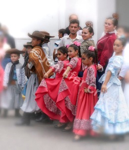 posing for pictures in traditional dress after a folk festival in Buenos Aires