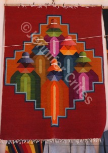 A colorful carpet or wall hanging for sale at a shop in Argentina.