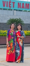 women in colorful dresses visiting Ho Chi Minh Mausoleum